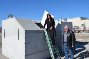 Saffa prepares to examine the inside of one of the 100 shelters the BGCO plans to install for storm survivors this year as Porter looks on.