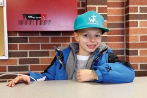Bennett Morris sports one of the Witness Kicks hats that were given away at OBU’s Witness Kicks Night. He helped collect 61 pairs of shoes from fans that evening.