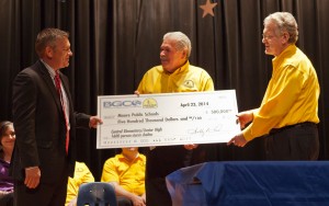 From left, Dr. Robert Romines, Superintendent of Moore Public Schools, receives a $500,000 check from Oklahoma Baptist Disaster Relief Director Sam Porter and Executive Director-Treasurer Dr. Anthony L. Jordan. The funds, which were presented on April 23, will help build a 1,600-person storm shelter at Central Elementary/Junior High in Moore. (Photo: Michael Davis, BGCO)